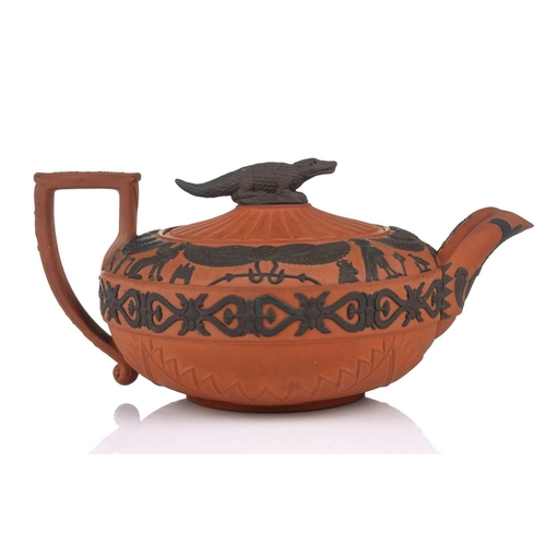 237 - A large Wedgwood rosso antico teapot and cover, early 19th century, with applied Egyptian decoration... 