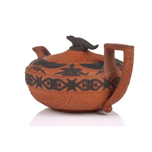 237 - A large Wedgwood rosso antico teapot and cover, early 19th century, with applied Egyptian decoration... 