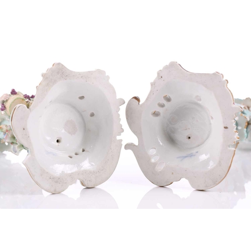 244 - A pair of German porcelain figural three sconce candelabra, with tre stum stems mounted with a brigh... 