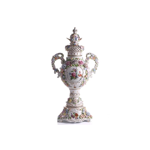 246 - A large German porcelain flower encrusted two handled trophy form urn and cover, 20th century, with ... 