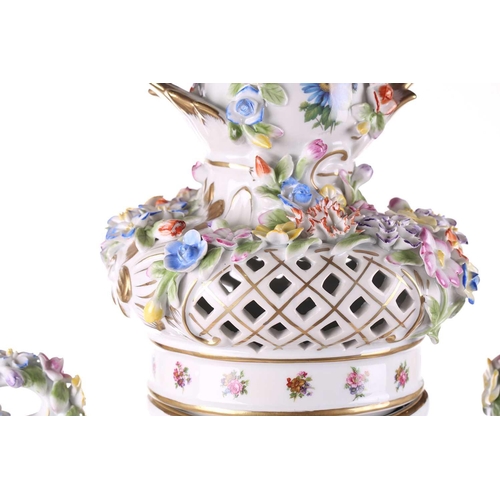 246 - A large German porcelain flower encrusted two handled trophy form urn and cover, 20th century, with ... 