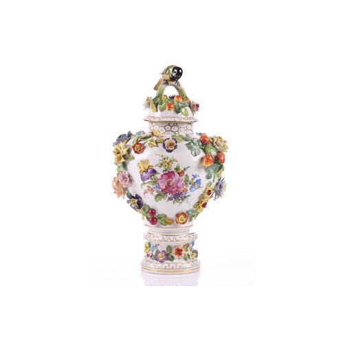 249 - A Dresden porcelain flower encrusted baluster vase and cover, early/mid 20th century, with high dome... 