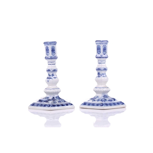 252 - A pair of Meissen porcelain 'Onion' pattern Dutch style squat candlesticks of hexagonal section, ear... 