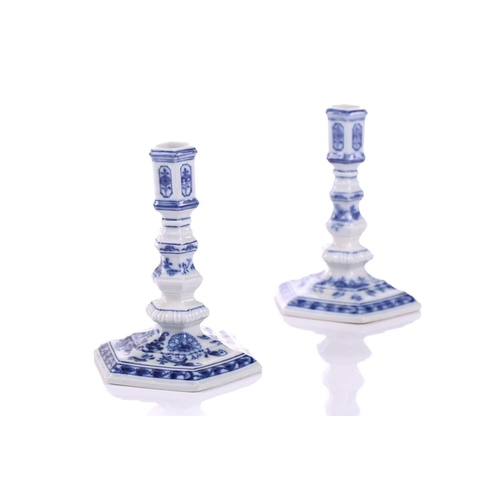 252 - A pair of Meissen porcelain 'Onion' pattern Dutch style squat candlesticks of hexagonal section, ear... 