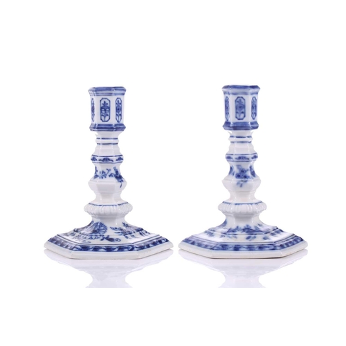 252 - A pair of Meissen porcelain 'Onion' pattern Dutch style squat candlesticks of hexagonal section, ear... 