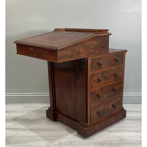 115A - An early Victorian mahogany Davenport desk with a sliding leather inset and fitted top section above... 