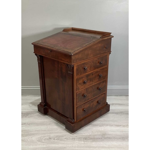 115A - An early Victorian mahogany Davenport desk with a sliding leather inset and fitted top section above... 