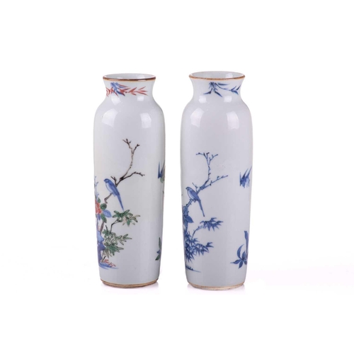 126 - A very close pair of Chinese porcelain vases, Qing, each almost identically decorated in underglaze ... 