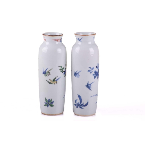 126 - A very close pair of Chinese porcelain vases, Qing, each almost identically decorated in underglaze ... 