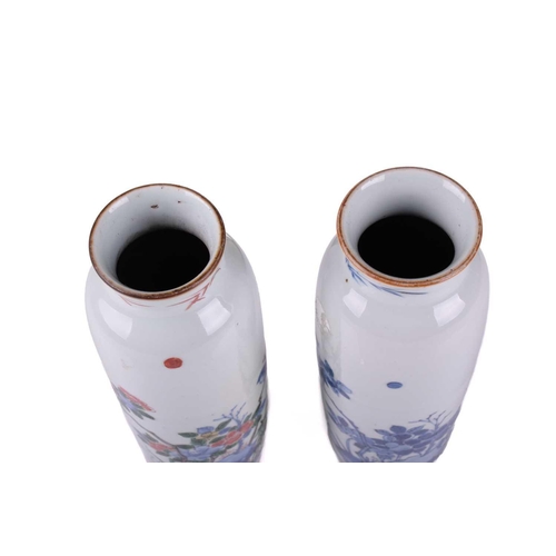 126 - A very close pair of Chinese porcelain vases, Qing, each almost identically decorated in underglaze ... 