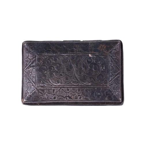 135 - A Tibetan white metal rectanguler box, the pierced top with a dragon amongst clouds with a border of... 