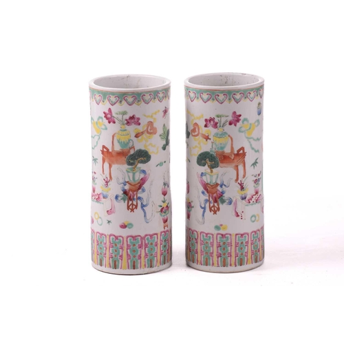 140 - A pair of Chinese porcelain sleeve vases, early 20th century, painted with a band of ruyi heads abov... 