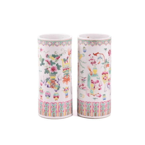 140 - A pair of Chinese porcelain sleeve vases, early 20th century, painted with a band of ruyi heads abov... 