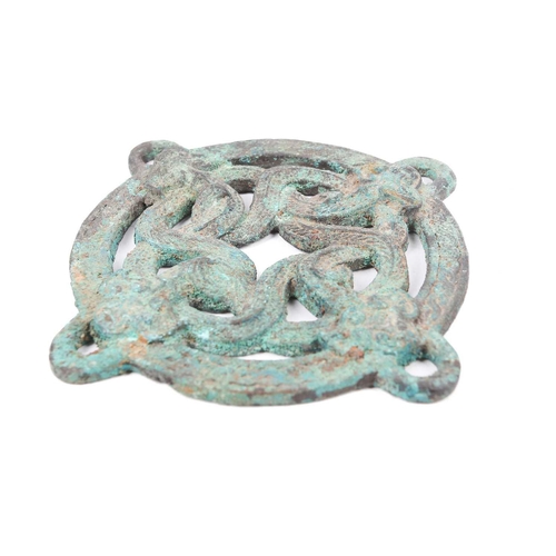 142 - A Warring States style Chinese bronze, possibly from a horse bridle, cast as four entwined dragons w... 