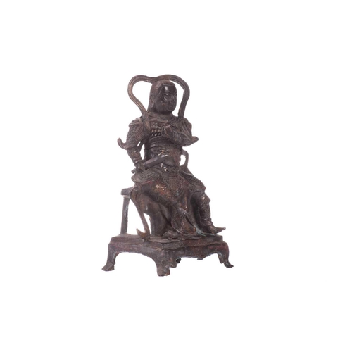 157 - A Chinese bronze figure of Zhenwu, seated wearing body armour and a sword in his left hand, a tortoi... 