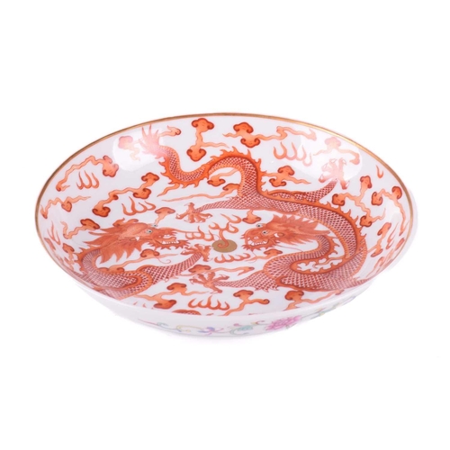 159 - A Chinese porcelain iron red dragon dish, painted with two opposing dragons with turquoise eyes and ... 