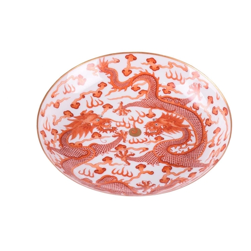 159 - A Chinese porcelain iron red dragon dish, painted with two opposing dragons with turquoise eyes and ... 