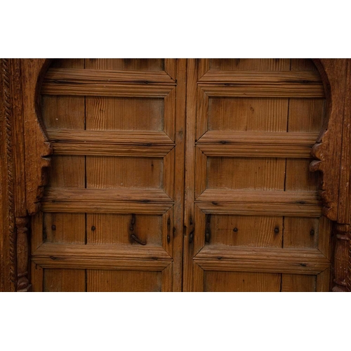 167 - A matched pair of 19th-century teak Haveli screen doors with pierced Arabeques and spindle decoratio... 