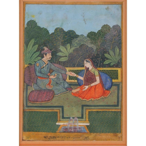 169 - 19th century Indian School, Shah and consort, seated on cushions within a fenced garden, a small fou... 