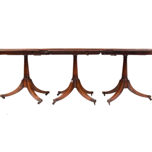 170 - A George III style triple mahogany extending pedestal dining table, old timber but early 20th centur... 