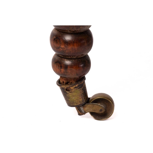 172 - A matched pair of William IV rosewood and simulated rosewood bobbin turned prie-dieu with brass cup ... 