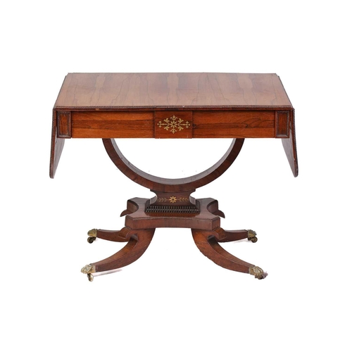 173 - A Regency brass inlaid figured rosewood two-flap sofa table with split bobbin moulded edge above a p... 