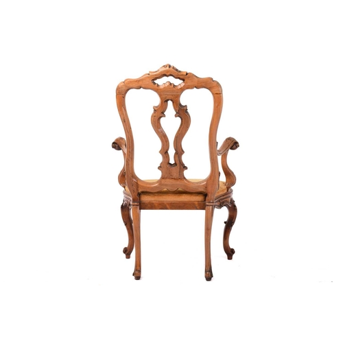 186 - An 18th-century Venetian style carved walnut open armchair, 20th century with shaped spoon back and ... 