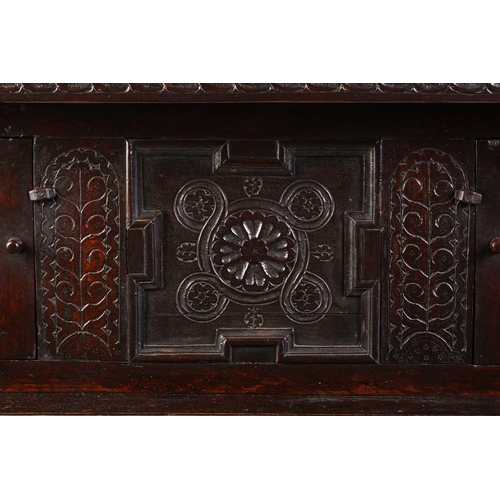 188 - A part 17th century joined oak court cupboard, two recessed cupboard doors flanked by heavy turned c... 