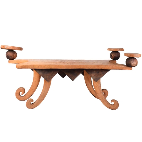 191 - A unique 20th-century artisanal rustic hewn elm serving table, with a shaped top, fitted three raise... 