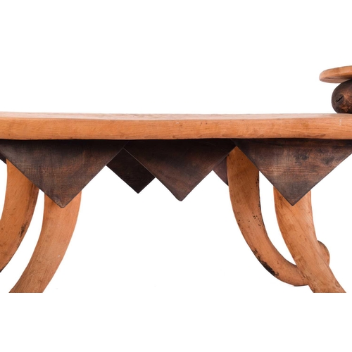 191 - A unique 20th-century artisanal rustic hewn elm serving table, with a shaped top, fitted three raise... 