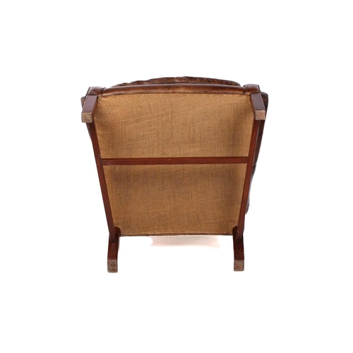 195 - A George III-style distressed hide upholstered gentleman's wingback armchair, 20th century, with mel... 