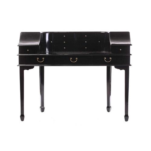 197 - A black lacquered Carlton House-type writing desk, 20th century, fitted with a bank of short drawers... 