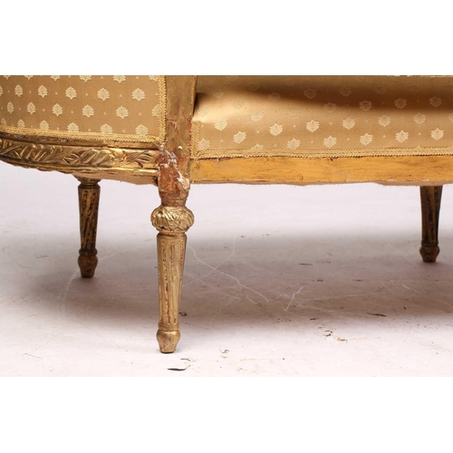 206 - A Louis XVI style carved and giltwood three-seat canape/ sofa, 20th century, with rose-carved cresti... 