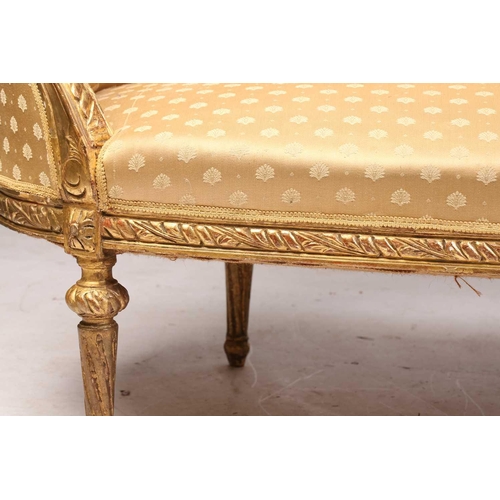 206 - A Louis XVI style carved and giltwood three-seat canape/ sofa, 20th century, with rose-carved cresti... 