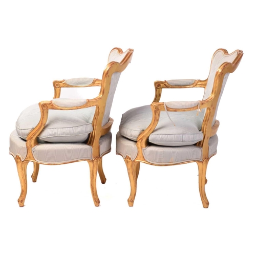 222 - A pair of French Louis XV-style carved wood and gilt gesso fauteuils, 20th century with serpentine c... 