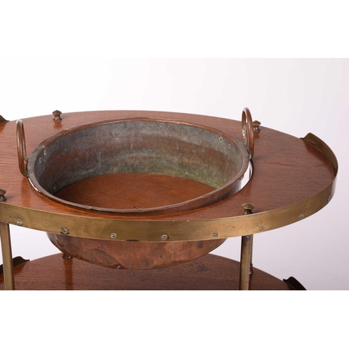 225 - An 'Army & Navy' style oval teakwood three-tier washstand, late 19th century with brass galleries an... 