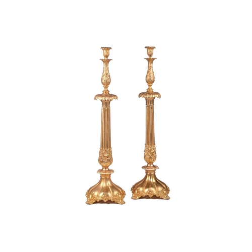 229 - A pair of large, impressive gilt metal table candelabrum with seven removable convolvulus vine branc... 