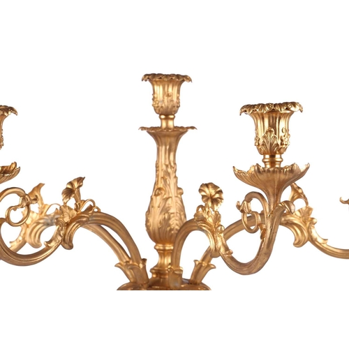 229 - A pair of large, impressive gilt metal table candelabrum with seven removable convolvulus vine branc... 