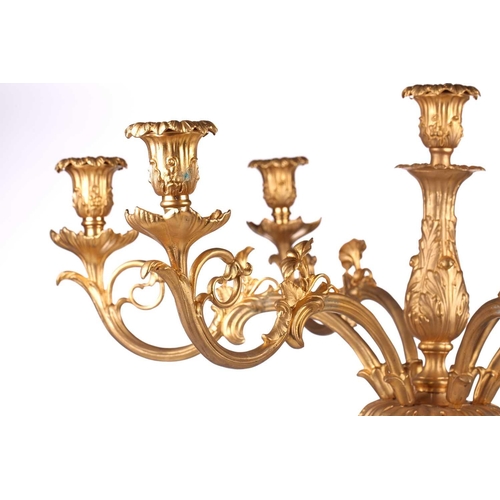 229 - A pair of large, impressive gilt metal table candelabrum with seven removable convolvulus vine branc... 