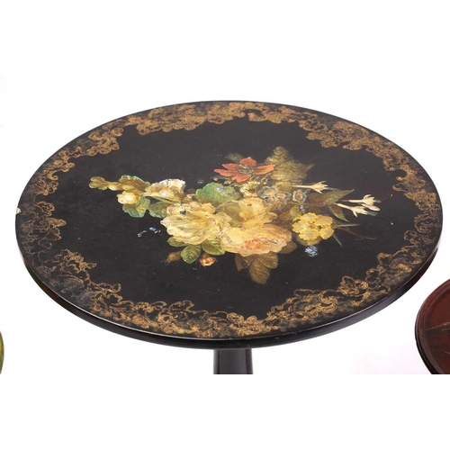 233 - A Victorian papier mache and Japanned snap top circular wine table, floral painted with cut blooms a... 