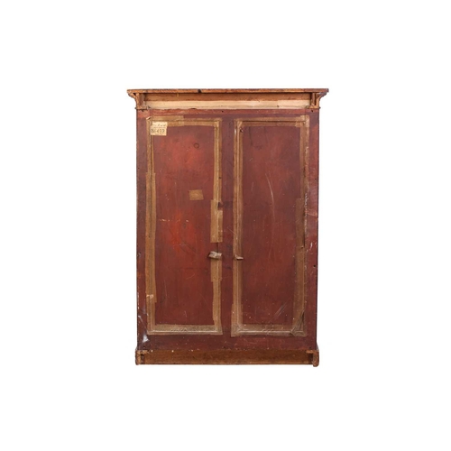 234 - An early Victorian mahogany housekeeper's cupboard, the pair of doors with arched panels opening to ... 