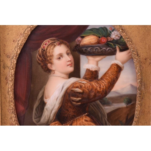 83 - A late 19th century framed oval porcelain plaque, probably KPM, painted after Titian, 'Girl with a B... 