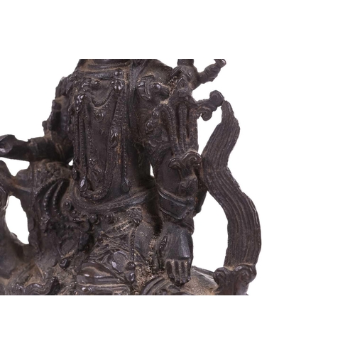 301 - A bronze figure of Bodhisattva Manjushri on a lion, probably 19th century, 23 cm high