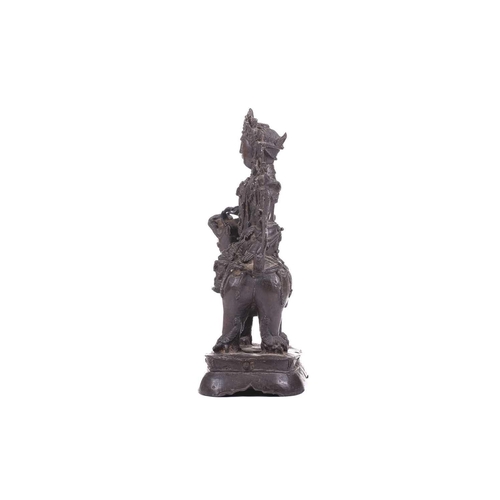 301 - A bronze figure of Bodhisattva Manjushri on a lion, probably 19th century, 23 cm high