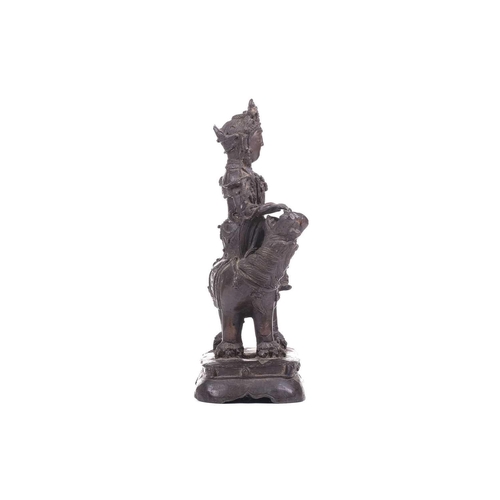 301 - A bronze figure of Bodhisattva Manjushri on a lion, probably 19th century, 23 cm high