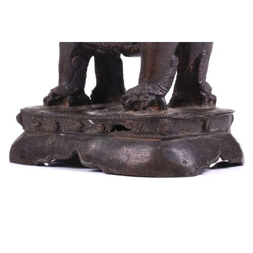 301 - A bronze figure of Bodhisattva Manjushri on a lion, probably 19th century, 23 cm high