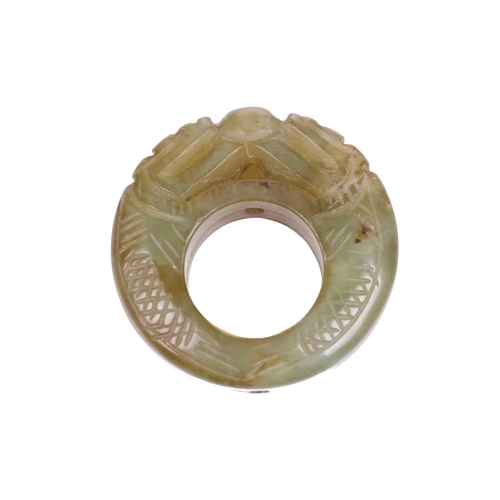 307 - A Chinese carved green/yellow jade pendant ring in the form of a pair of scaley pig dragons contesti... 