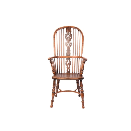 312 - A 19th century Nottinghamshire yew wood and ash high back Windsor chair, with shaped and pierced bac... 