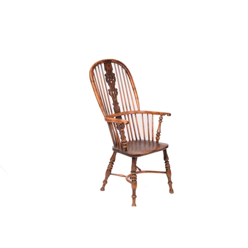 312 - A 19th century Nottinghamshire yew wood and ash high back Windsor chair, with shaped and pierced bac... 