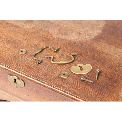 319 - An 18th-century oak kneehole writing desk fitted with a central frieze drawer above a further six sh... 